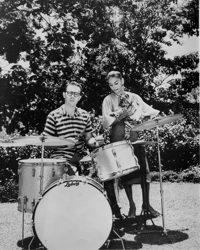 Joe Morello on drums with unidentified Sri Lankan woman holding tiger cub (Columbo, Sri Lanka)