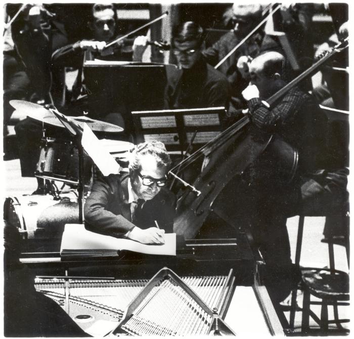 Dave Brubeck editing a score with an orchestra