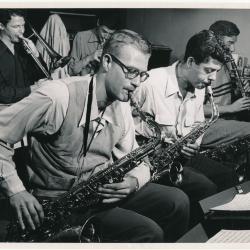 Dave Van Kriedt on tenor saxophone (L), Frank Alley on tenor saxophone (R), Bill Smith on clarinet, Bob Collins on trombone, and Dick Collins on trumpet in rehearsal (San Francisco, California)