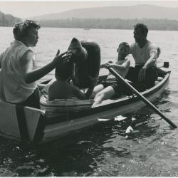 Dave Brubeck, Iola Brubeck, Dan Brubeck, and Michael Brubeck in rowboat with inflatable beach toy on a lake in the Berkshires
