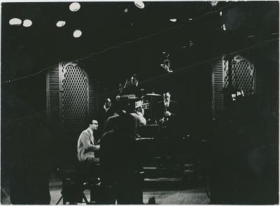 Dave Brubeck in performance with cameraman in foreground on Steve Allen TV Show (New York City, New York)