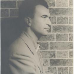 Dave Brubeck in profile against brick wall (New York City, New York)