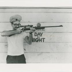 Max Weiss of Fantasy Records with rifle