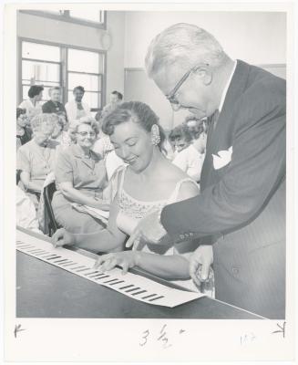 Mrs. Jane Findley of El Cerrito and Chuck Dutton at the paper keyboard while class watches during a "Dave teaches teachers" session for Alameda County school teachers (California)
