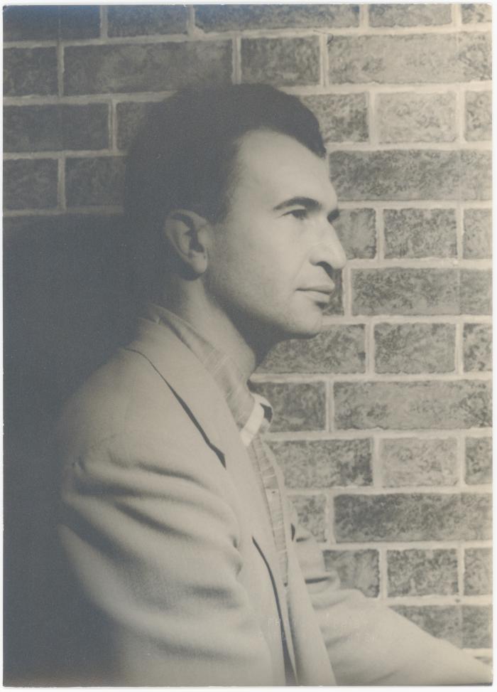 Dave Brubeck in profile against brick wall (New York City, New York)