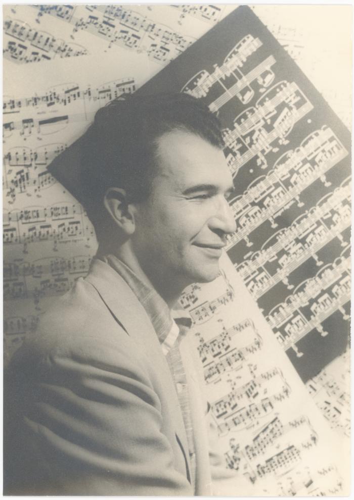 Dave Brubeck in profile against sheet music background  (New York City, New York)