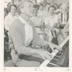 Mrs. Frances Kerr of Berkeley playing piano while class watches during a "Dave teaches teachers" session for Alameda County school teachers (California)