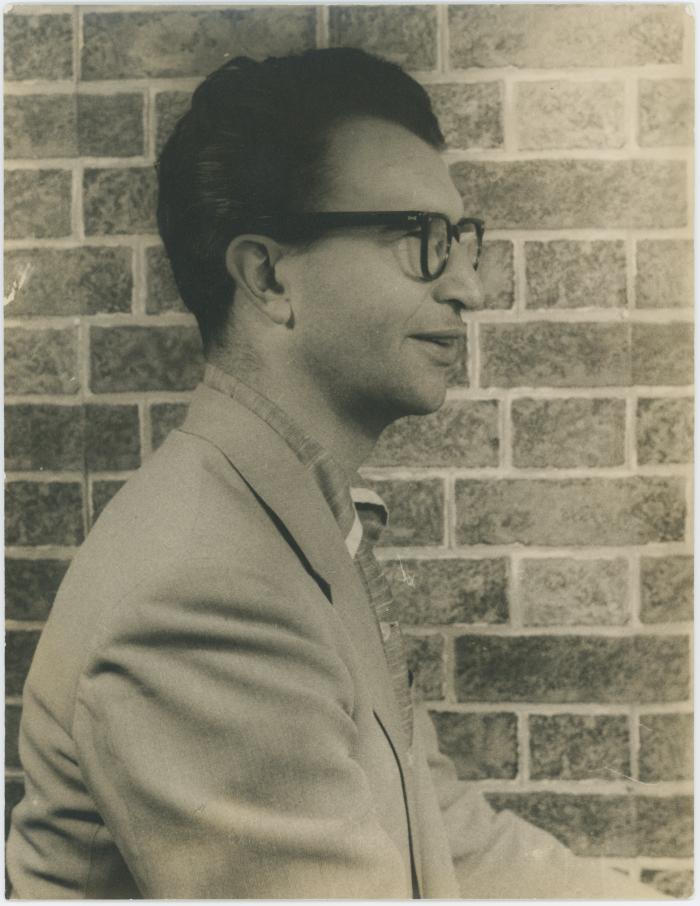 Dave Brubeck in profile against brick wall (New York City, New York)