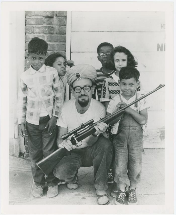 Max Weiss of Fantasy Records with rifle and children