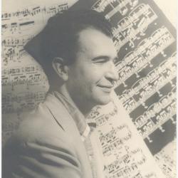Dave Brubeck in profile against sheet music background  (New York City, New York)