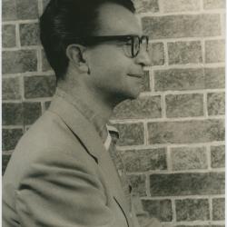 Dave Brubeck in profile against brick wall (New York City, New York)