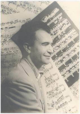 Dave Brubeck in profile against sheet music background  (New York City, New York)