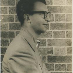 Dave Brubeck in profile against brick wall (New York City, New York)