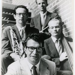 Dave Brubeck, Paul Desmond, Lloyd Davis, Ron Crotty against brick wall