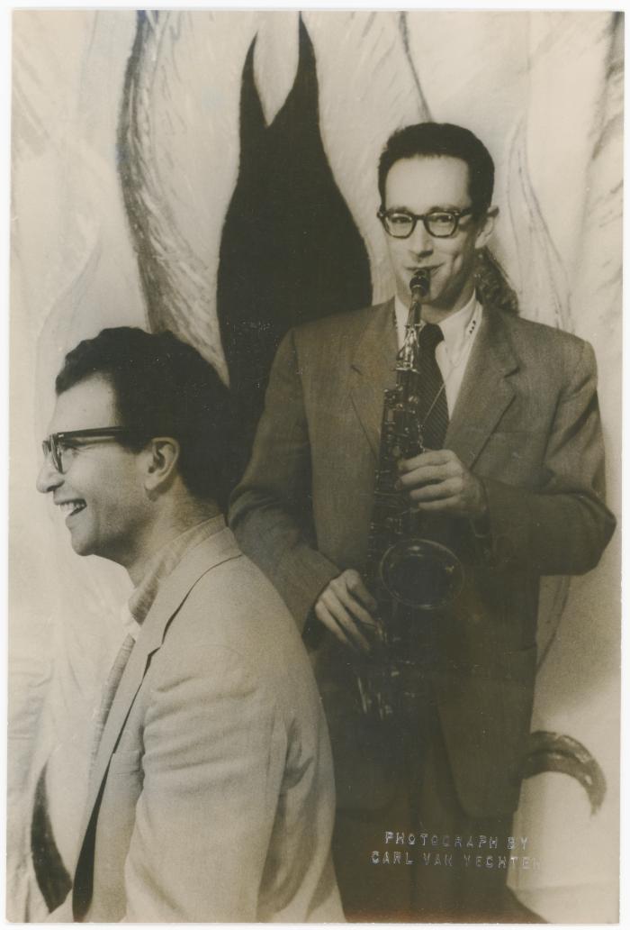 Dave Brubeck, Paul Desmond with saxophone against stylized flames background (New York City, New York)