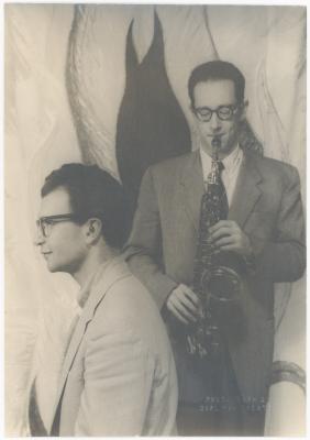 Dave Brubeck, Paul Desmond with saxophone against stylized flames background (New York City, New York)