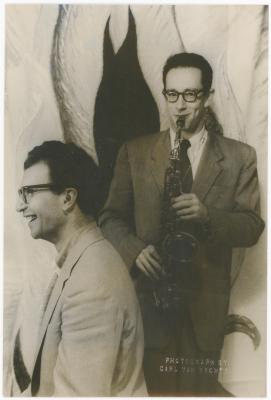 Dave Brubeck, Paul Desmond with saxophone against stylized flames background (New York City, New York)