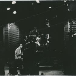 Dave Brubeck in performance with cameraman in foreground on Steve Allen TV Show (New York City, New York)