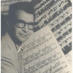 Dave Brubeck in profile against sheet music background  (New York City, New York)