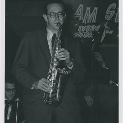 Paul Desmond in performance at The Black Hawk with Norman Bates partially in view on bass (San Francisco, California)