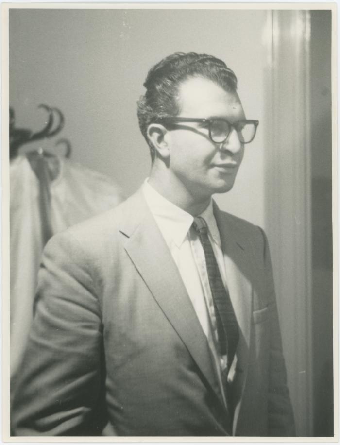 Dave Brubeck in front of a coat rack (Newcastle, United Kingdom)