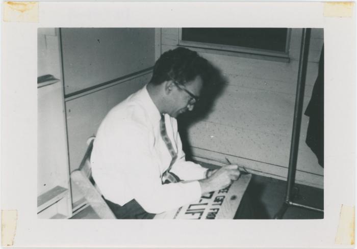 Dave Brubeck autographing "Jazz Lift" cartoon at 1st Annual Detroit Jazz Festival (Detroit, Michigan)