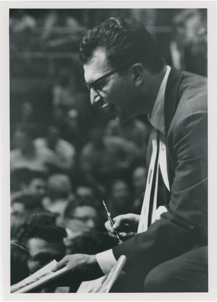 Dave Brubeck (pen in hand), audience in background (Gainesville, Florida [?])