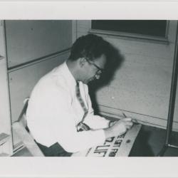 Dave Brubeck autographing "Jazz Lift" cartoon at 1st Annual Detroit Jazz Festival (Detroit, Michigan)