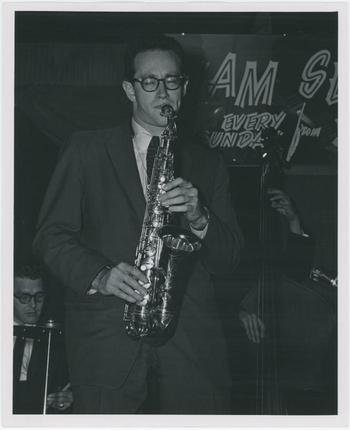 Paul Desmond in performance at The Black Hawk with Norman Bates partially in view on bass (San Francisco, California)