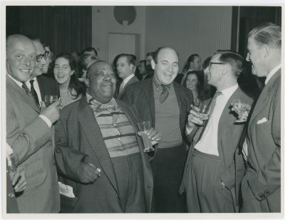 Jimmy Rushing between two unidentified men at a reception given in his, Dave Brubeck's and Buck Clayton's honor (London, United Kingdom)