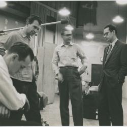 Norman Bates (foreground), Dave Brubeck, Joe Morello, and Paul Desmond listening to playback #4 (New York City, New York [?])