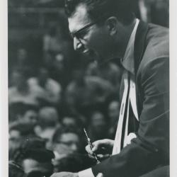 Dave Brubeck (pen in hand), audience in background (Gainesville, Florida [?])