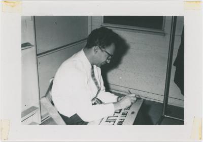 Dave Brubeck autographing "Jazz Lift" cartoon at 1st Annual Detroit Jazz Festival (Detroit, Michigan)
