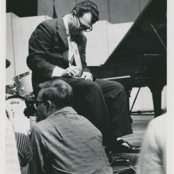 Dave Brubeck signing autographs from the stage, audience in foreground (Gainesville, Florida [?])