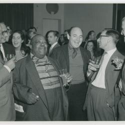 Jimmy Rushing between two unidentified men at a reception given in his, Dave Brubeck's and Buck Clayton's honor (London, United Kingdom)