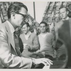 Dave Brubeck in performance, with Phi Alpha fraternity students in background (University of Pennsylvania, Philadelphia, Pennsylvania)