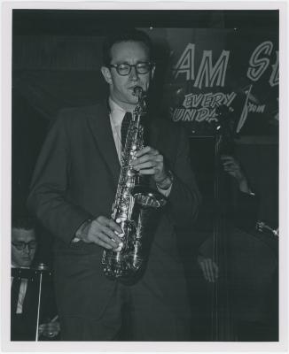 Paul Desmond in performance at The Black Hawk with Norman Bates partially in view on bass (San Francisco, California)