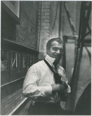 Dave Brubeck tying tie in alley