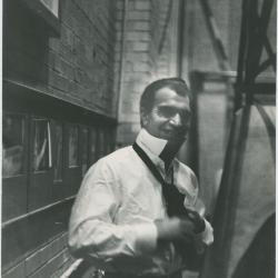 Dave Brubeck tying tie in alley