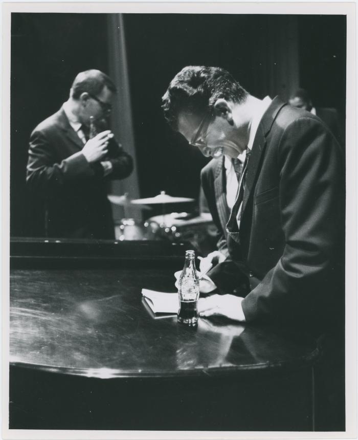Dave Brubeck with Coca Cola bottle, Joe Morello in background (Milwaukee, Wisconsin)