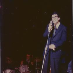 Dave Brubeck at microphone and Joe Morello in performance