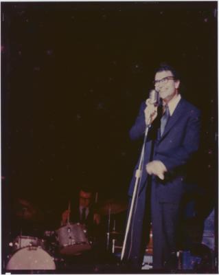 Dave Brubeck at microphone and Joe Morello in performance