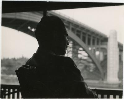 Dave Brubeck at railing looking at bridge