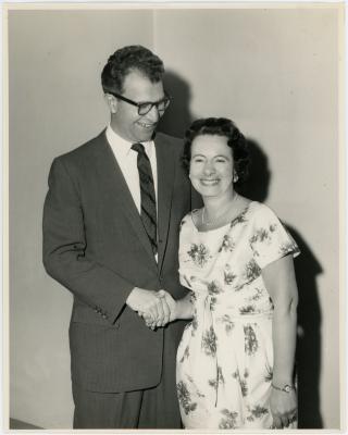 Dave Brubeck and unidentified woman wearing a floral print dress (Melbourne, Australia)
