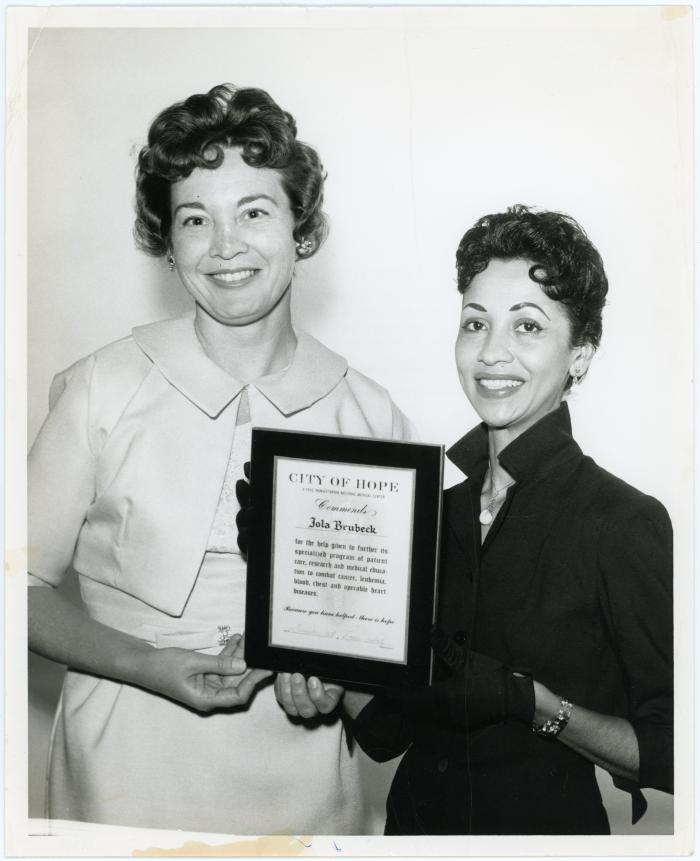 Iola Brubeck receiving award, Mrs. Earl Hines representing City of Hope
