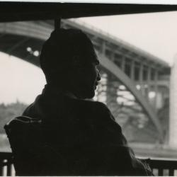 Dave Brubeck at railing looking at bridge