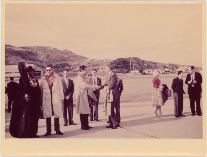 Dave Brubeck shakes hands with official (airport, New Zealand)