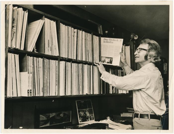 Dave Brubeck taking record from bookcase (Wilton, Connecticut)