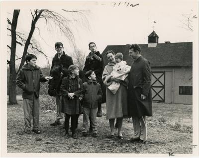 Dave Brubeck, Iola Brubeck, Cathy Brubeck, Michael Brubeck, Dan Brubeck, Darius Brubeck, Chris Brubeck, and Matt Brubeck in front of a barn (Wilton, Connecticut [?])
