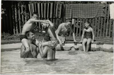Dave Brubeck, Iola Brubeck, Cathy Brubeck, Dan Brubeck, Darius Brubeck, Michael Brubeck, and Chris Brubeck in a pool at Irving Townsend house (Wilton, Connecticut)